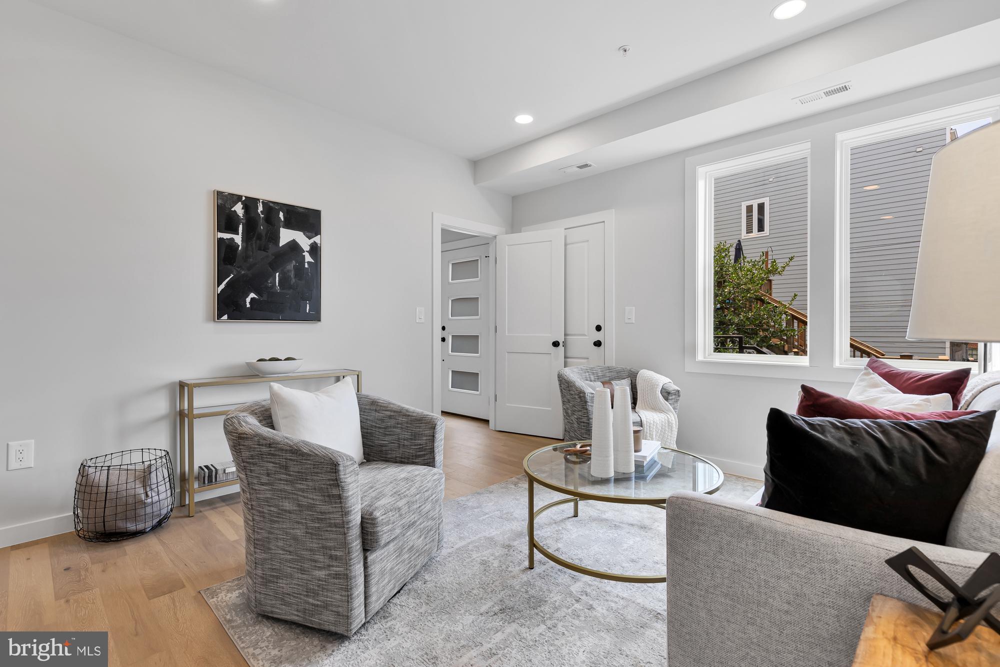 537 Park Road Northwest, Unit TH2 Washington, DC 20010 - Photo 39 of 60 a living room with furniture and wooden floor