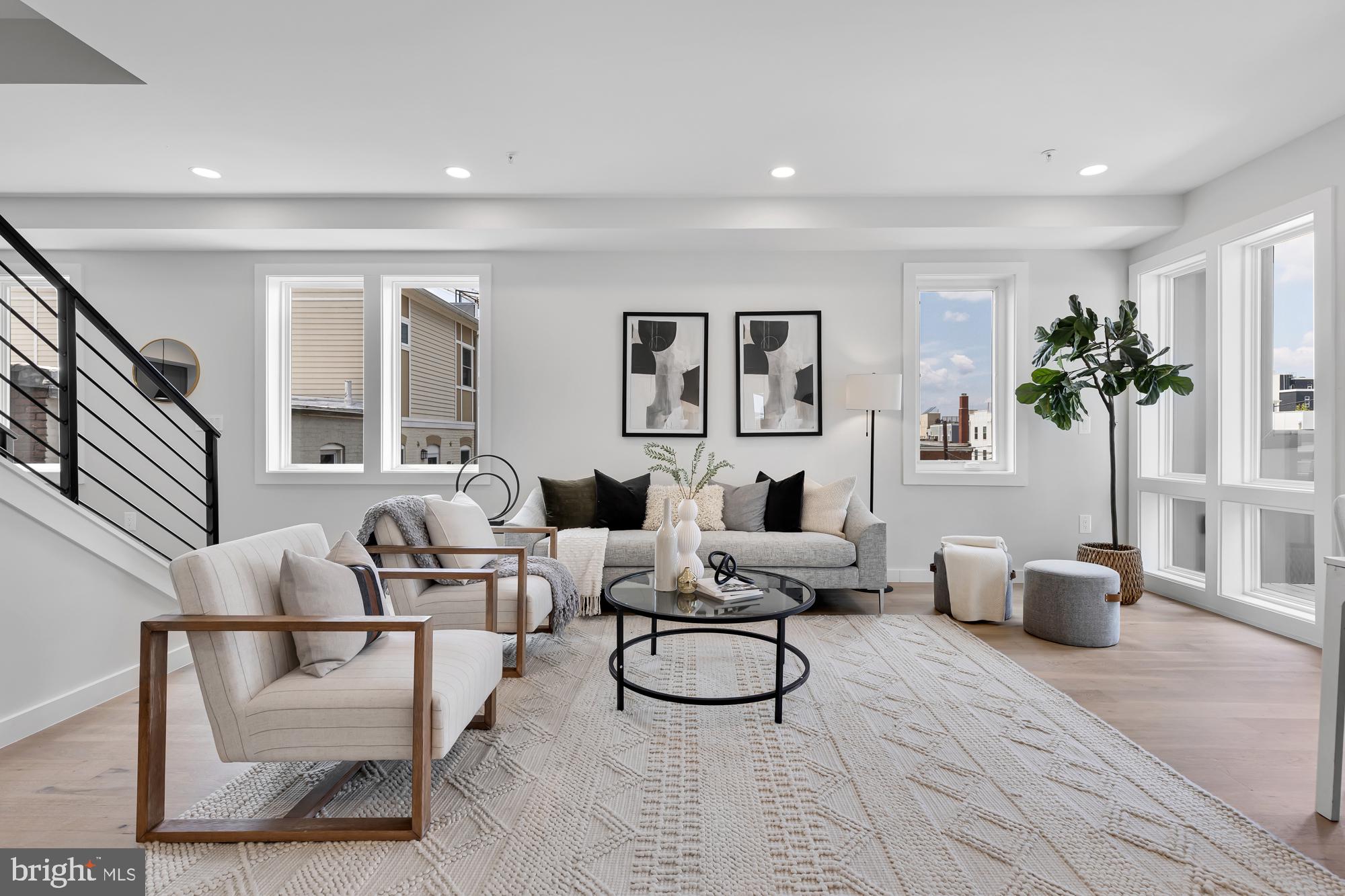537 Park Road Northwest, Unit TH2 Washington, DC 20010 - Photo 4 of 60 a living room with furniture and a potted plant