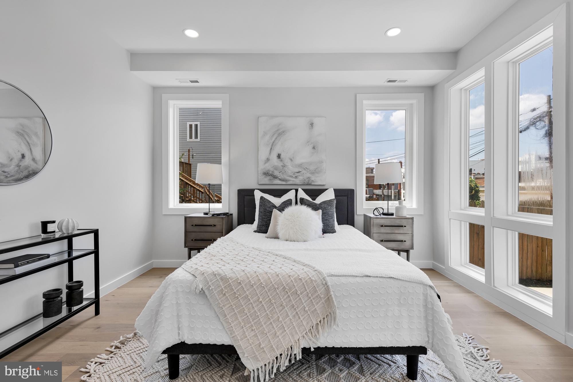 537 Park Road Northwest, Unit TH2 Washington, DC 20010 - Photo 42 of 60 a bedroom with a bed and wooden floor