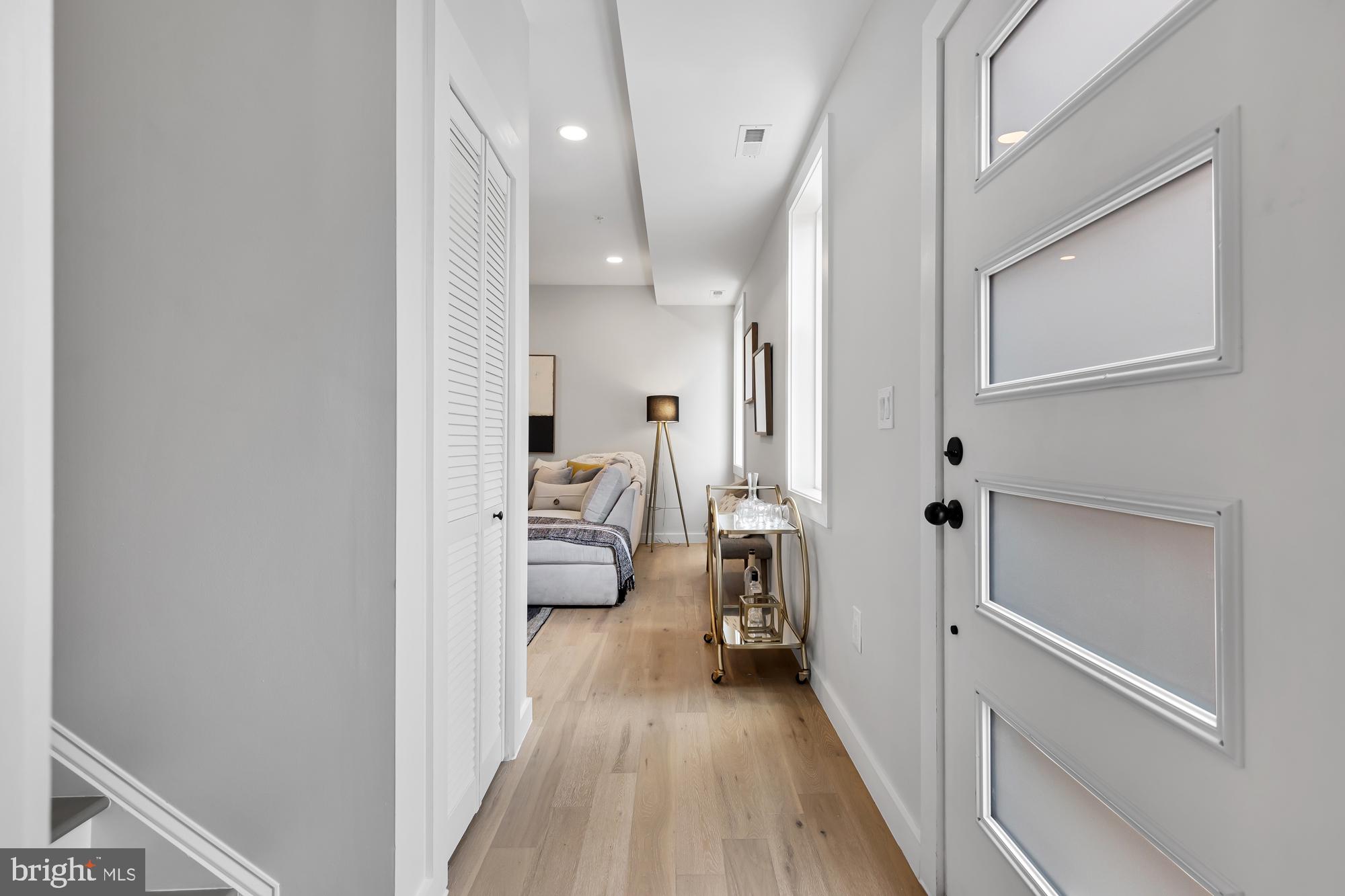 537 Park Road Northwest, Unit TH2 Washington, DC 20010 - Photo 46 of 60 a view of a bedroom with a bed and wooden floor