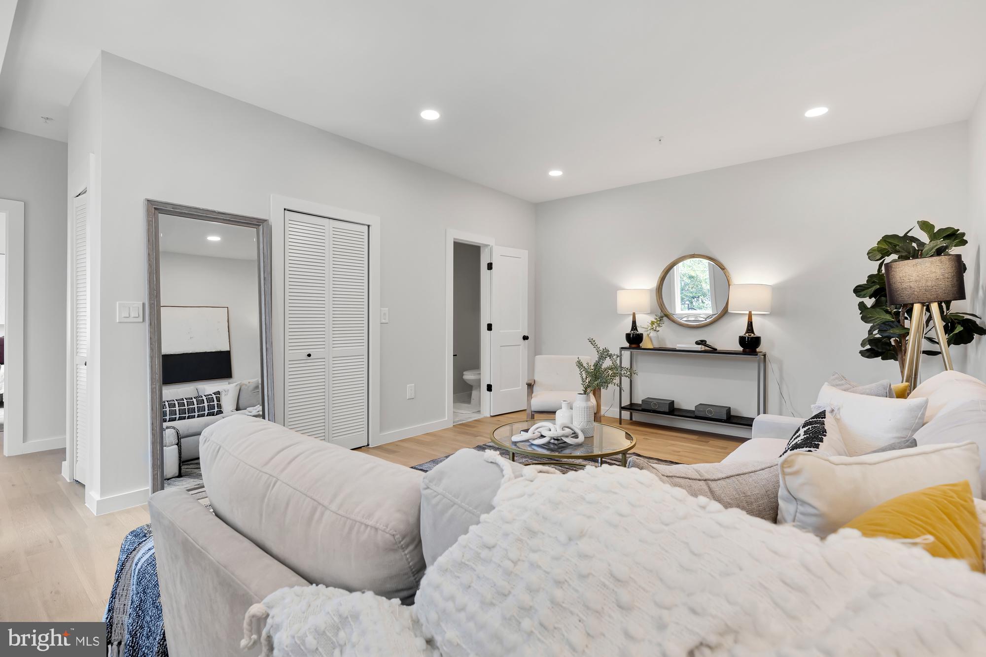 537 Park Road Northwest, Unit TH2 Washington, DC 20010 - Photo 49 of 60 a living room with furniture and a wooden floor