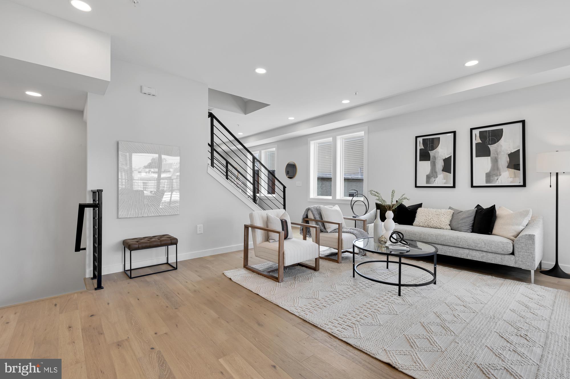 537 Park Road Northwest, Unit TH2 Washington, DC 20010 - Photo 5 of 60 a living room with furniture and a wooden floor