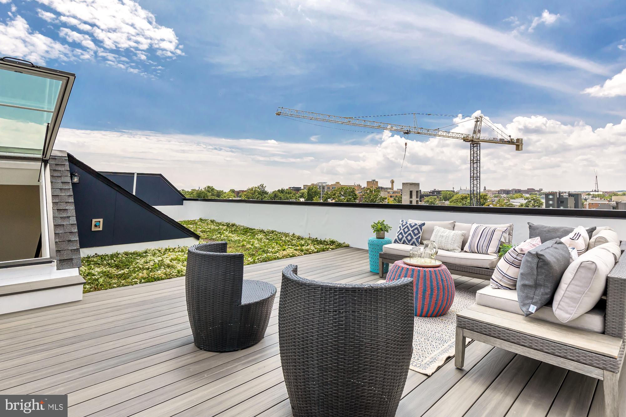 537 Park Road Northwest, Unit TH2 Washington, DC 20010 - Photo 53 of 60 a view of a roof deck with couches and wooden floor
