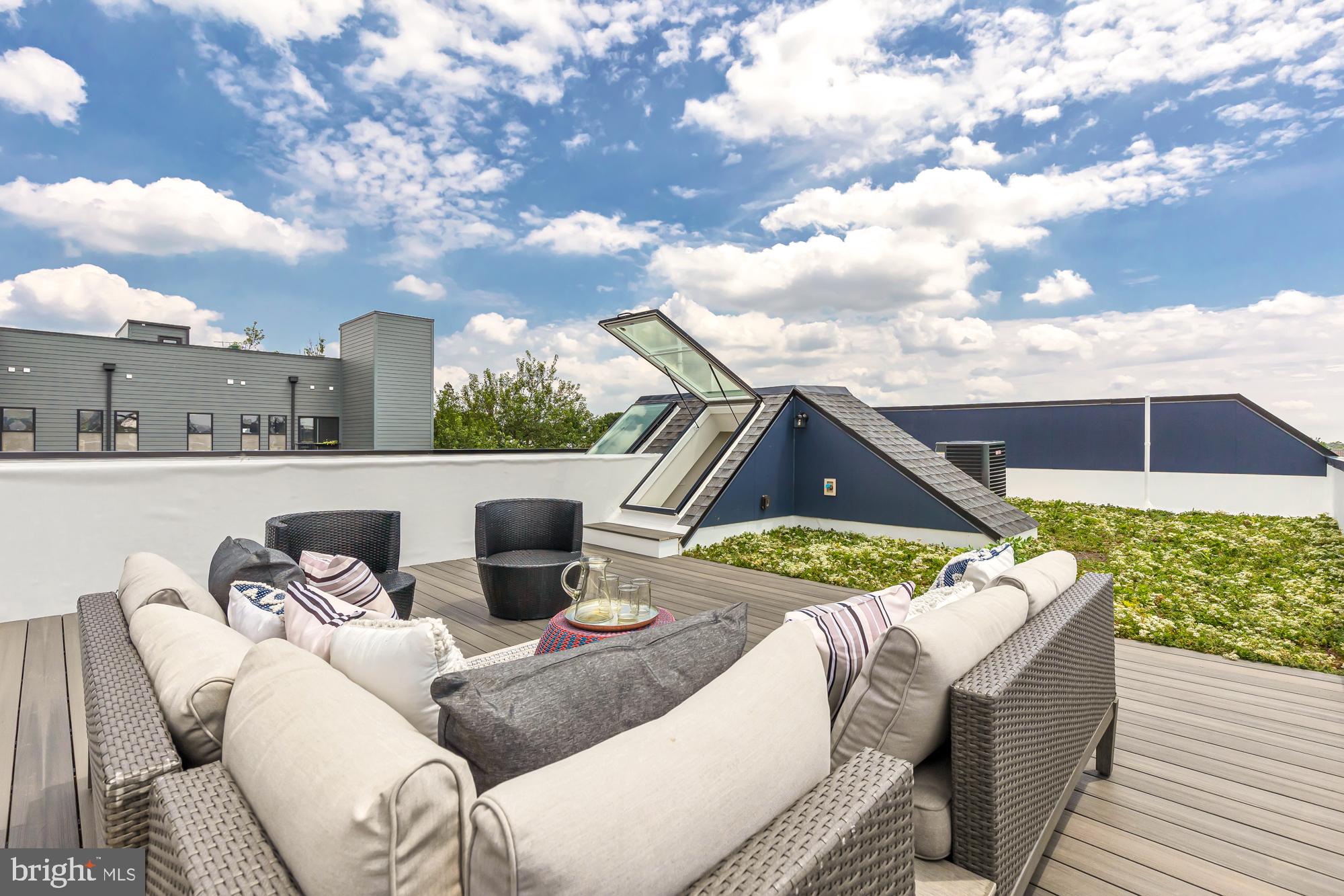 537 Park Road Northwest, Unit TH2 Washington, DC 20010 - Photo 55 of 60 a terrace of a house with outdoor seating