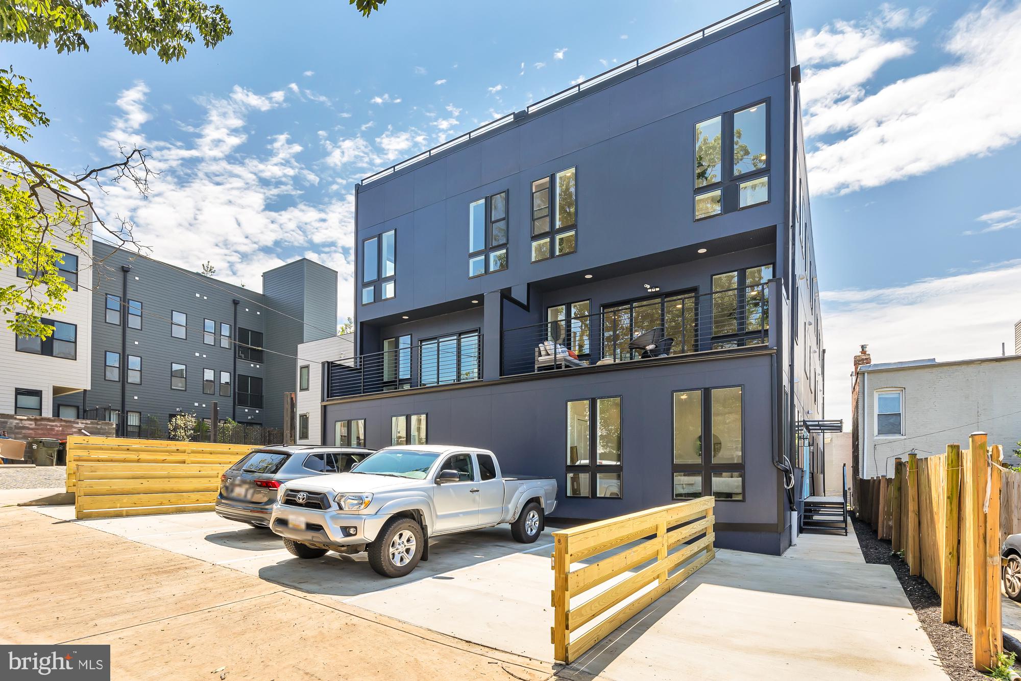 537 Park Road Northwest, Unit TH2 Washington, DC 20010 - Photo 59 of 60 a car parked in front of a building