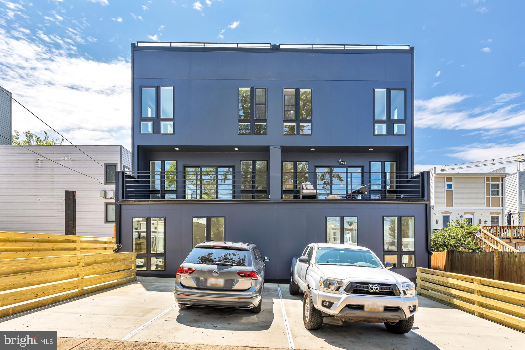 537 Park Road Northwest, Unit TH2 Washington, DC 20010 - Photo 60 of 60 a car parked in front of a building