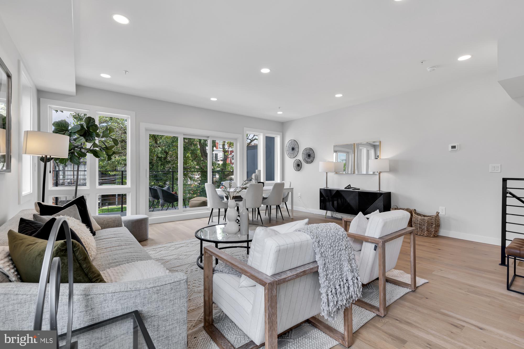 537 Park Road Northwest, Unit TH2 Washington, DC 20010 - Photo 7 of 60 a living room with furniture and a large window