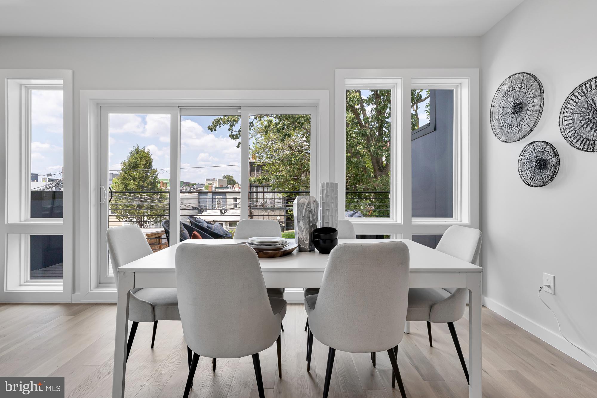 537 Park Road Northwest, Unit TH2 Washington, DC 20010 - Photo 10 of 60 a view of a dining room with furniture window and wooden floor