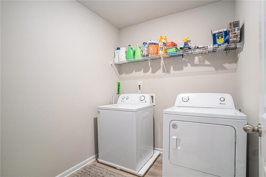 453 Sawmill Trace Hampton, GA 30228 - Photo 14 of 34 a utility room with dryer and washer