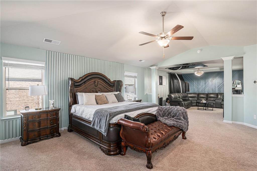 453 Sawmill Trace Hampton, GA 30228 - Photo 15 of 34 a bedroom with a bed ceiling fan and a window