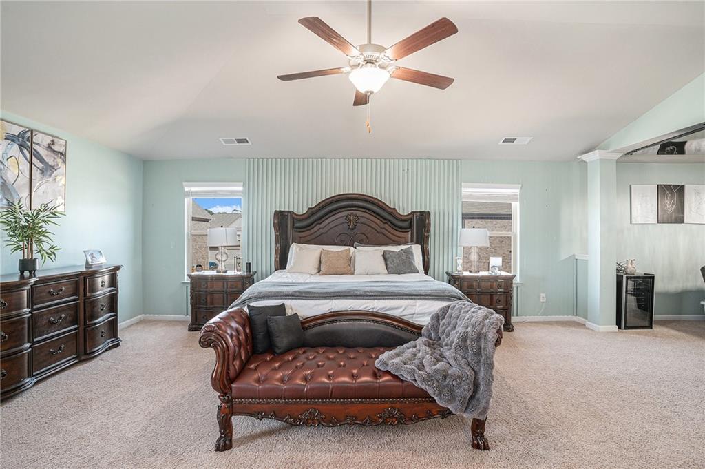 453 Sawmill Trace Hampton, GA 30228 - Photo 16 of 34 a bedroom with a bed and ceiling fan