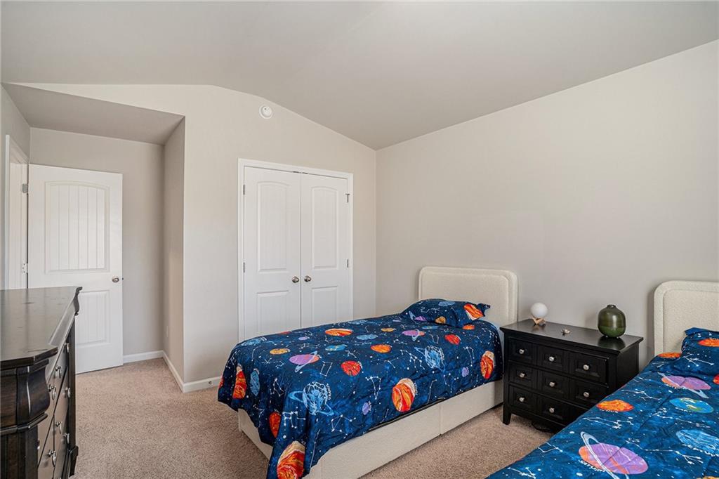 453 Sawmill Trace Hampton, GA 30228 - Photo 30 of 34 a bedroom with a bed and a dresser in it