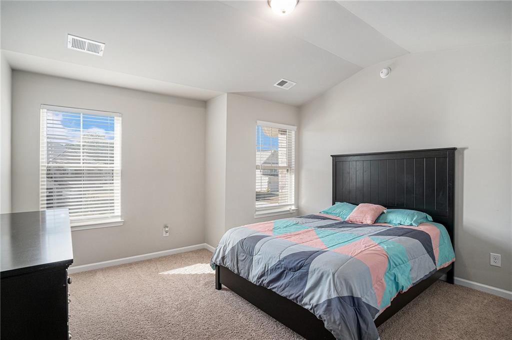 453 Sawmill Trace Hampton, GA 30228 - Photo 31 of 34 a bedroom with a bed and a window