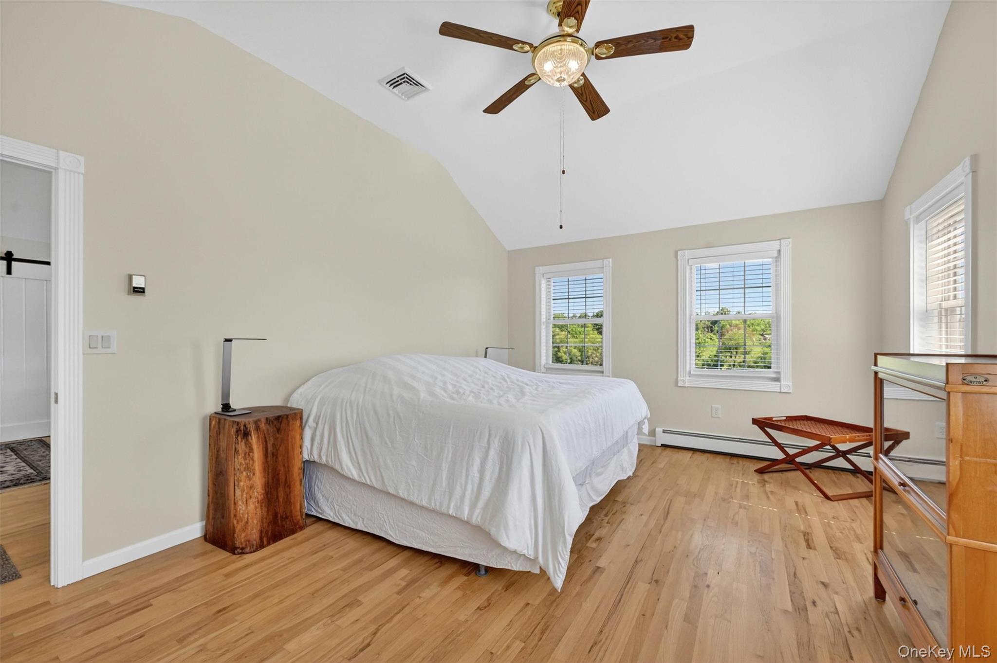 954 Ridgebury Road New Hampton, NY 10958 - Photo 29 of 45 The second-floor primary suite offers a quiet blank slate, ready to be styled into your own private retreat. With a spacious bedroom, large walk-in closet, and ensuite bath with dual sinks and a shower, this suite adds comfort, flexibility, and privacy to the home’s thoughtful layout.