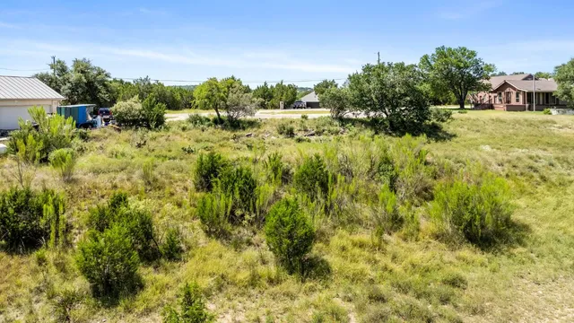 an aerial view of residential building with parking space