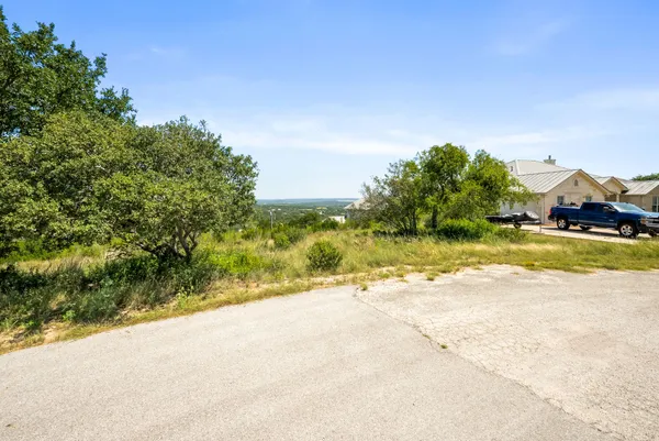 a view of a swimming pool with a yard
