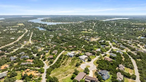 an aerial view of a house with a yard and garden