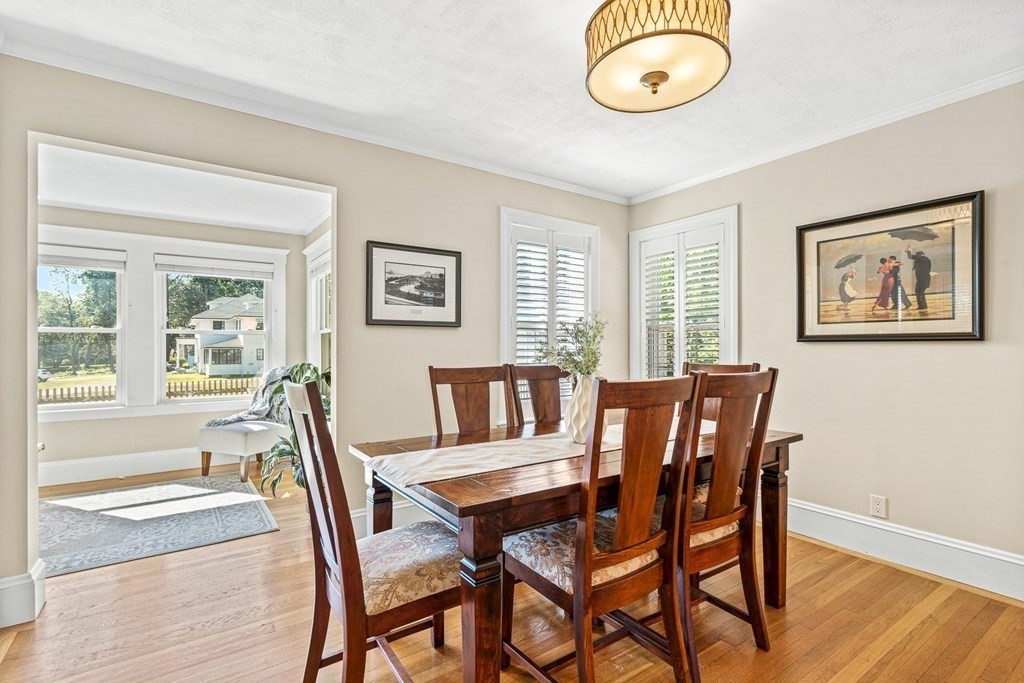 7 Perkins Avenue Reading, MA 01867 - Photo 14 of 42 a view of a dining room with furniture wooden floor and a window