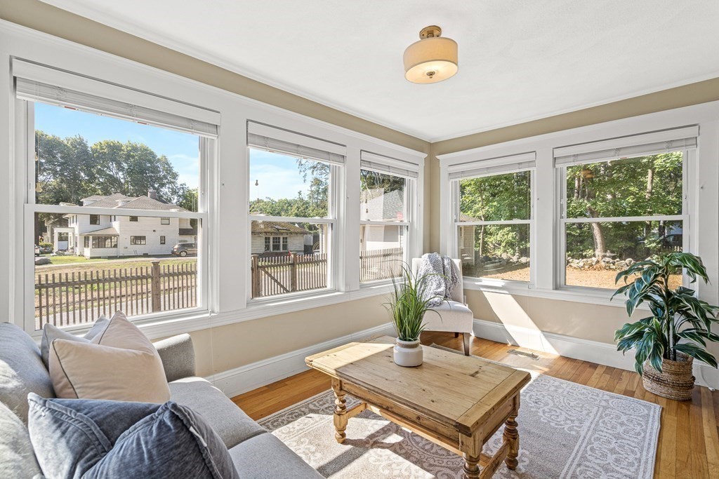 7 Perkins Avenue Reading, MA 01867 - Photo 16 of 42 a living room with furniture and a window