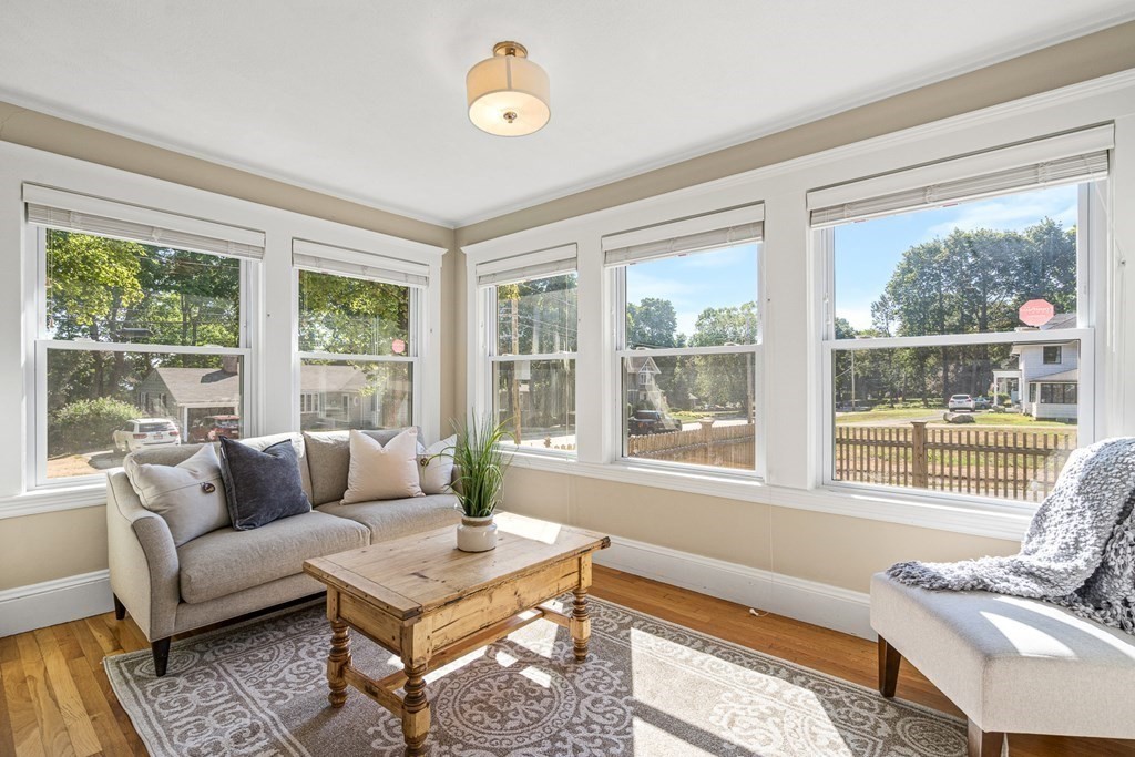 7 Perkins Avenue Reading, MA 01867 - Photo 17 of 42 a living room with furniture and a large window