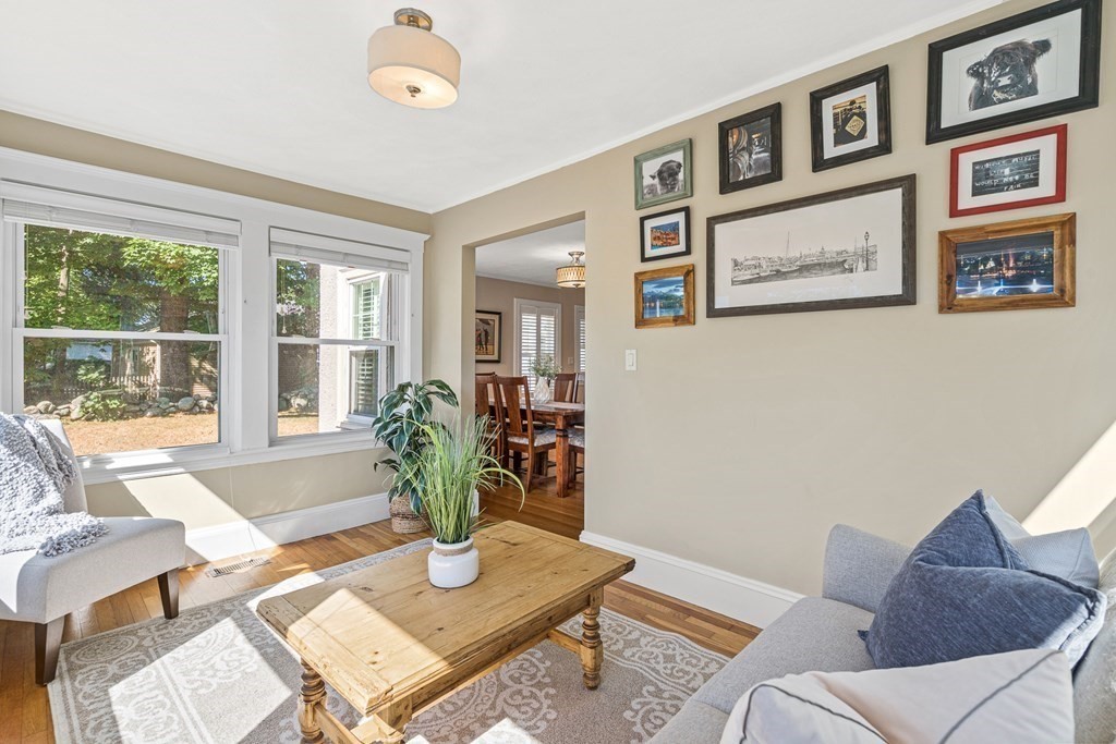 7 Perkins Avenue Reading, MA 01867 - Photo 18 of 42 a living room with furniture and a large window