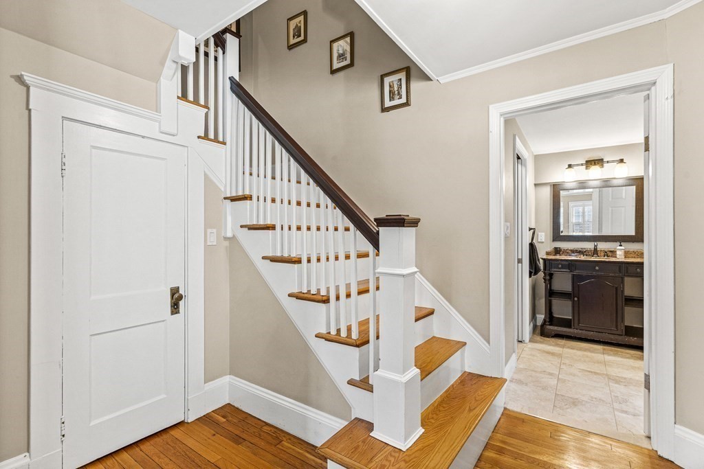 7 Perkins Avenue Reading, MA 01867 - Photo 25 of 42 a view of entryway and hall with wooden floor