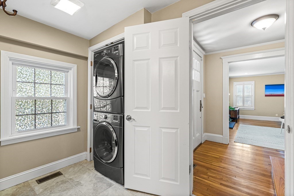 7 Perkins Avenue Reading, MA 01867 - Photo 27 of 42 a view of a hallway with washer and dryer