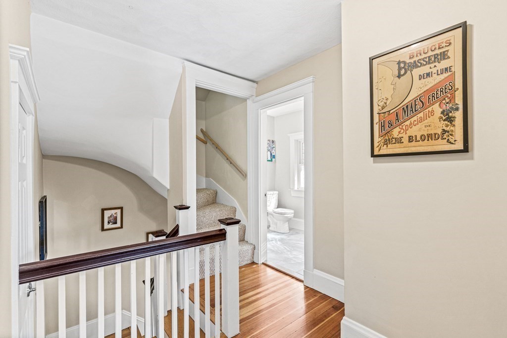 7 Perkins Avenue Reading, MA 01867 - Photo 28 of 42 a view of a hallway with staircase