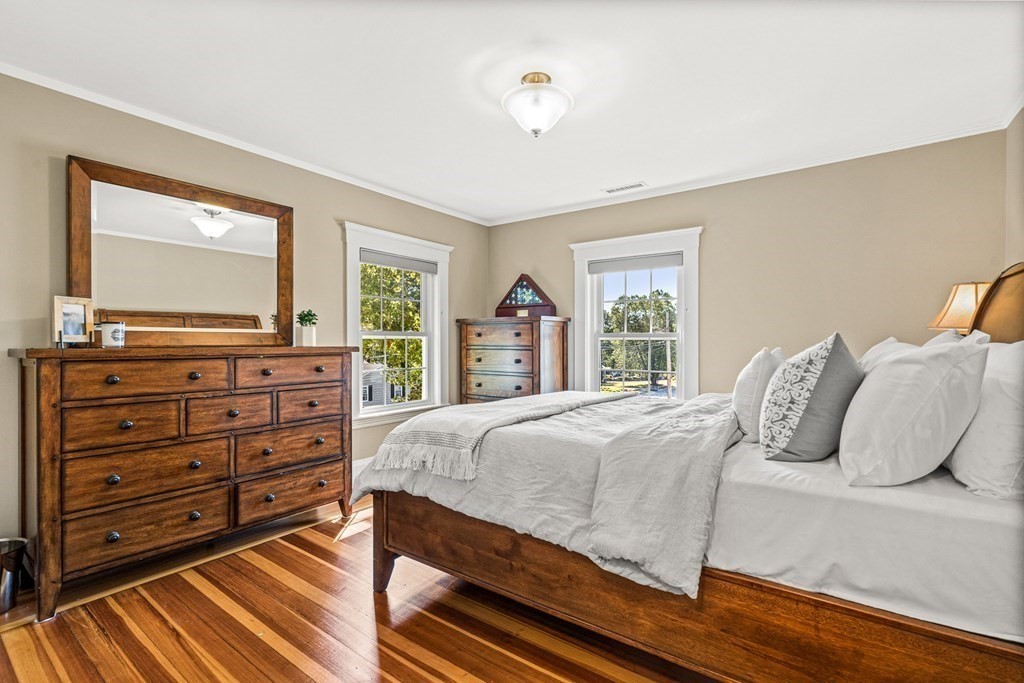 7 Perkins Avenue Reading, MA 01867 - Photo 29 of 42 a bedroom with a bed and a dresser