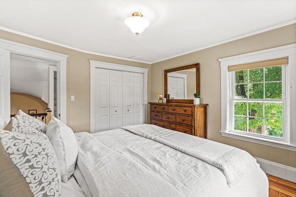 7 Perkins Avenue Reading, MA 01867 - Photo 30 of 42 a bedroom with a bed and a window