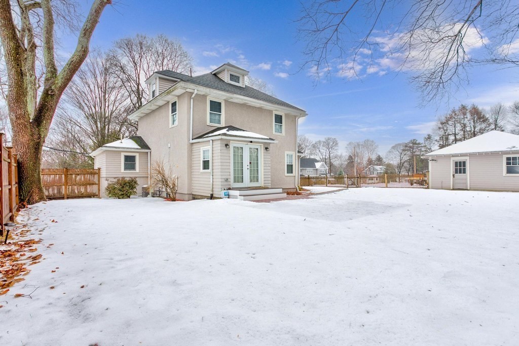 7 Perkins Avenue Reading, MA 01867 - Photo 3 of 42 a view of a house with a snow in the yard