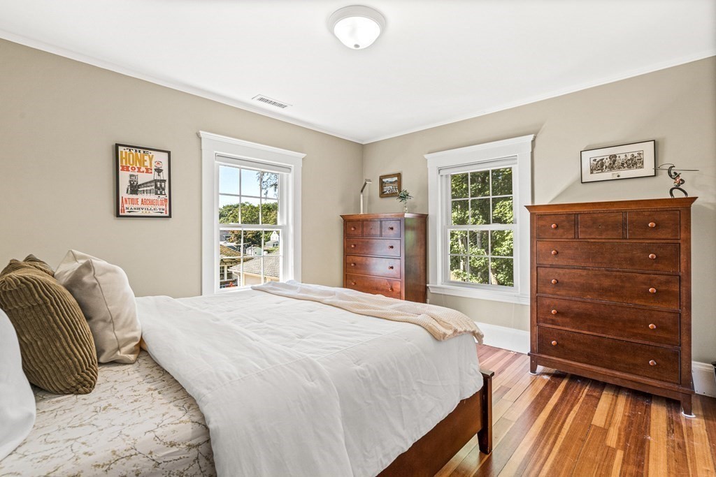 7 Perkins Avenue Reading, MA 01867 - Photo 31 of 42 a bedroom with a bed and a dresser