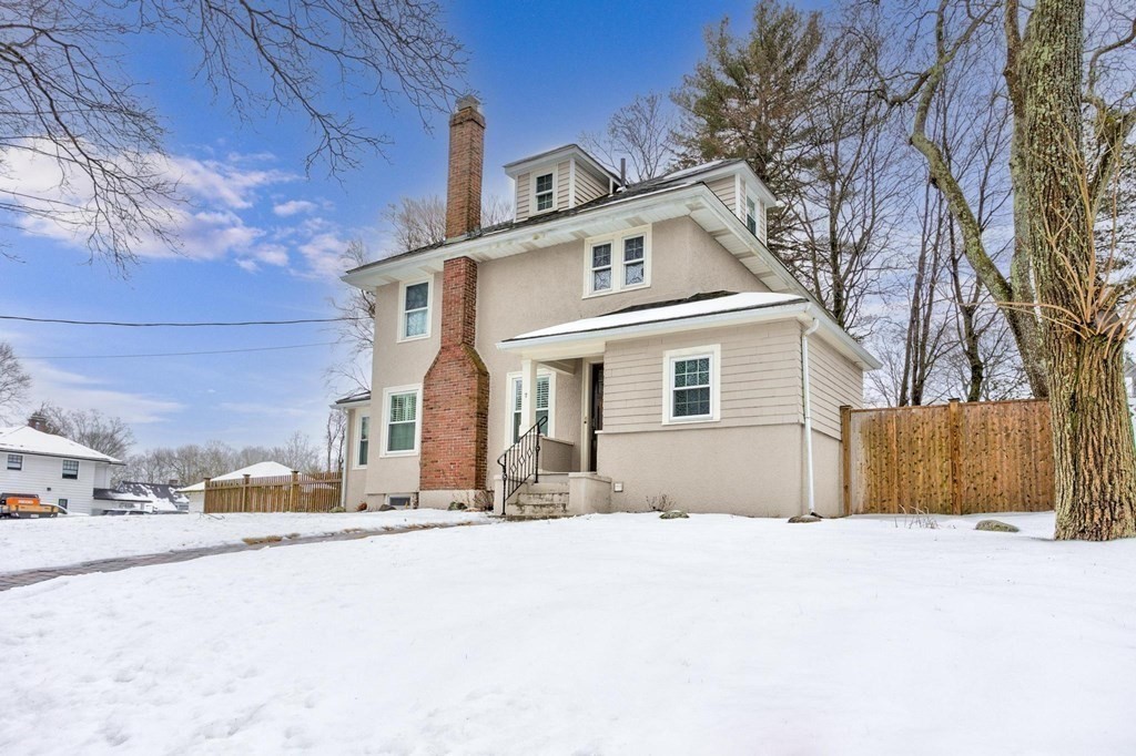 7 Perkins Avenue Reading, MA 01867 - Photo 39 of 42 a front view of a house with a yard