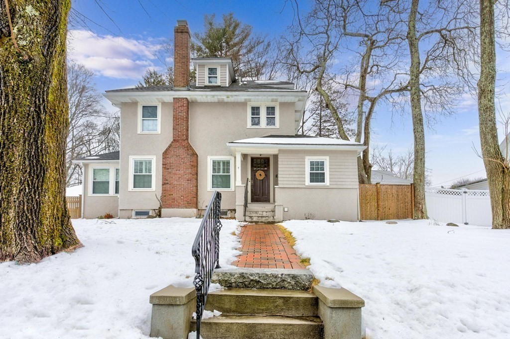 7 Perkins Avenue Reading, MA 01867 - Photo 40 of 42 a view of a white house with a large tree