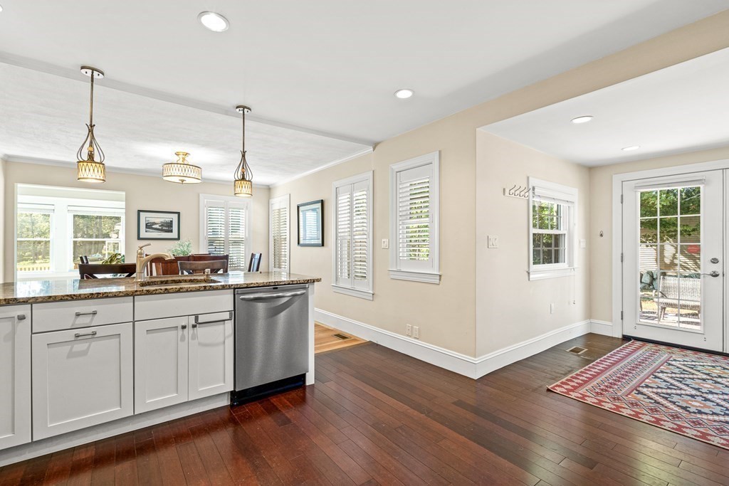 7 Perkins Avenue Reading, MA 01867 - Photo 7 of 42 a open kitchen with sink cabinets and wooden floor