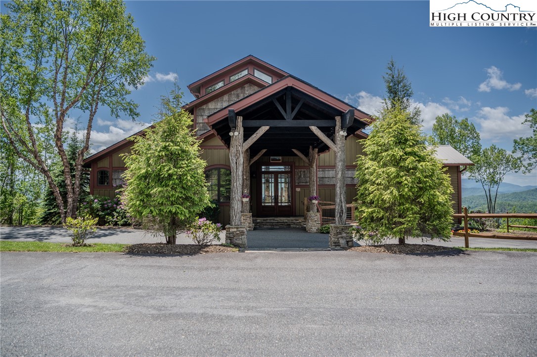 0 Beaver Dam Road Elk Park, NC 28622 - Photo 7 of 14 a front view of a house with a yard