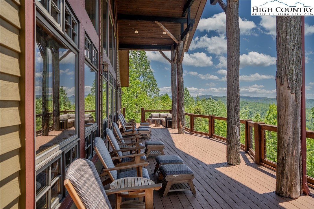 0 Beaver Dam Road Elk Park, NC 28622 - Photo 8 of 14 a living room with large windows and wooden floor