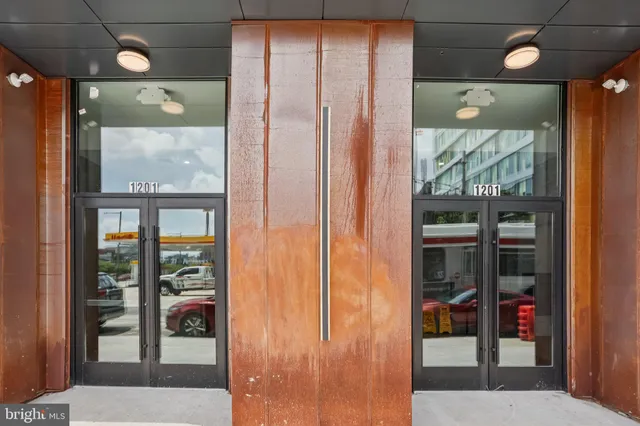 a bathroom with a glass shower door and a mirror