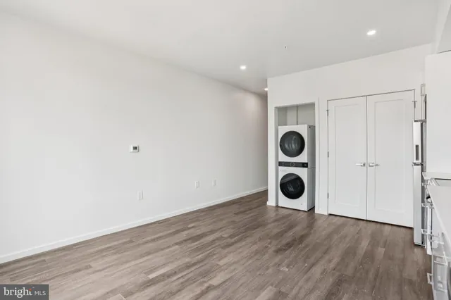 a view of an empty room and wooden floor