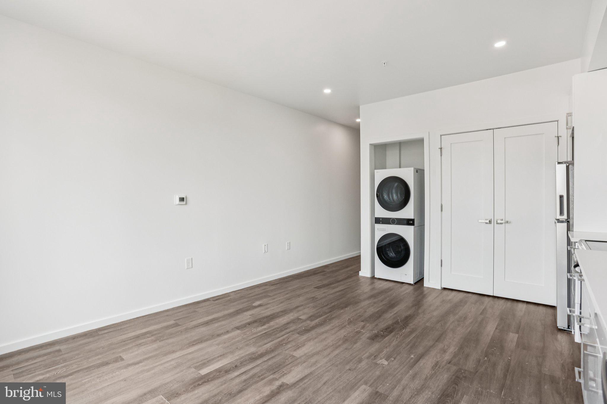 1201 Vine Street, Unit STUDIO Philadelphia, PA 19107 - Photo 7 of 29 a view of an empty room and wooden floor