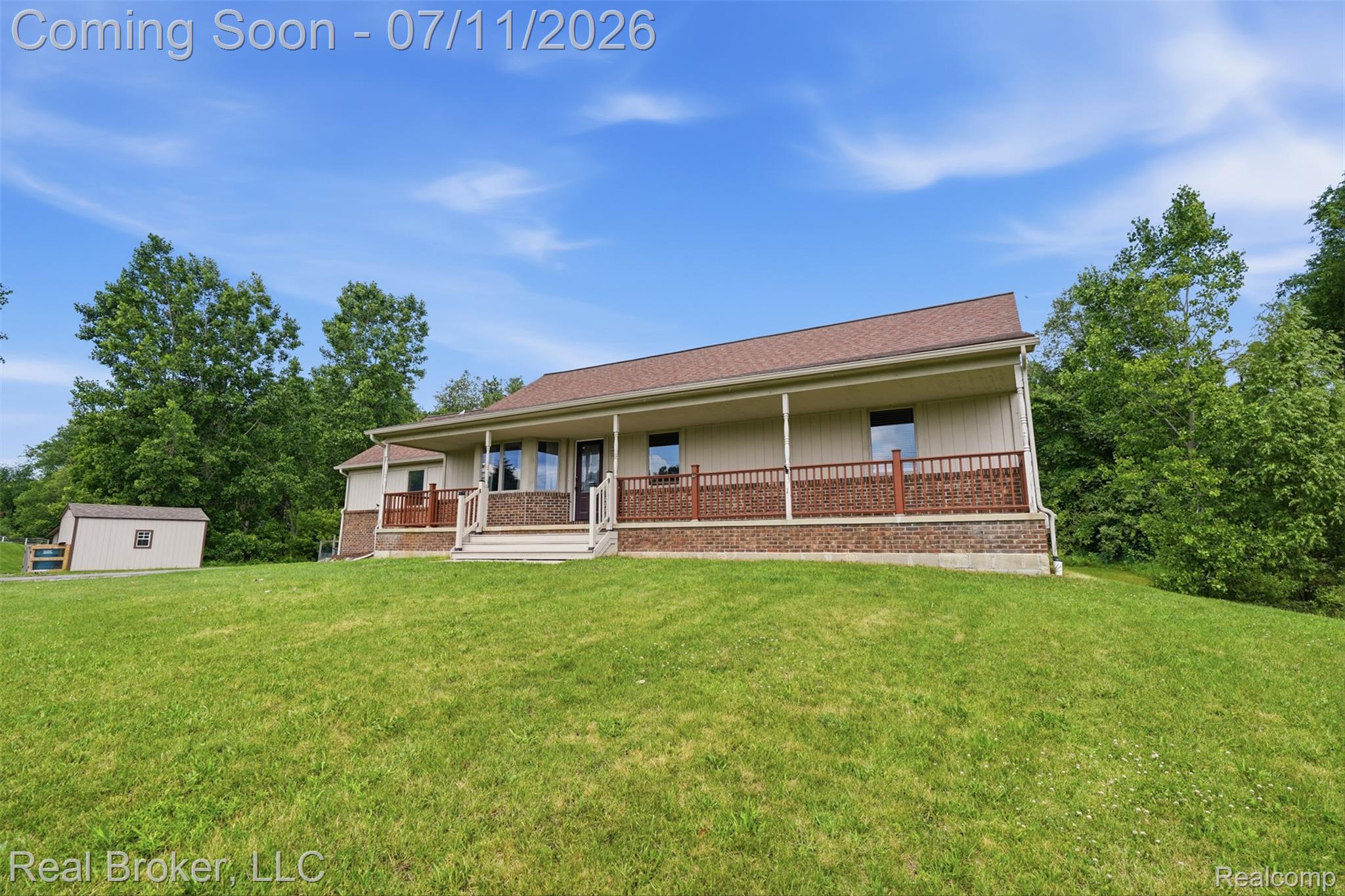 1050 West Brocker Road Metamora, MI 48455 - Photo 53 of 55 Ranch-style residence featuring a covered front porch with wood railings and brick-look siding accents