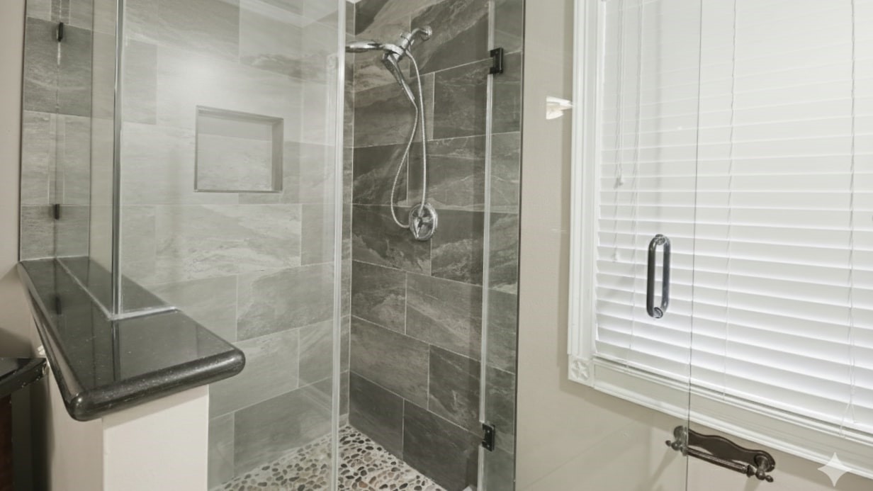 1431 Walnut Lane Houston, TX 77339 - Photo 16 of 46 Indulge in the luxurious primary bathroom with a modern shower, elegant tilework, and a sleek glass enclosure.