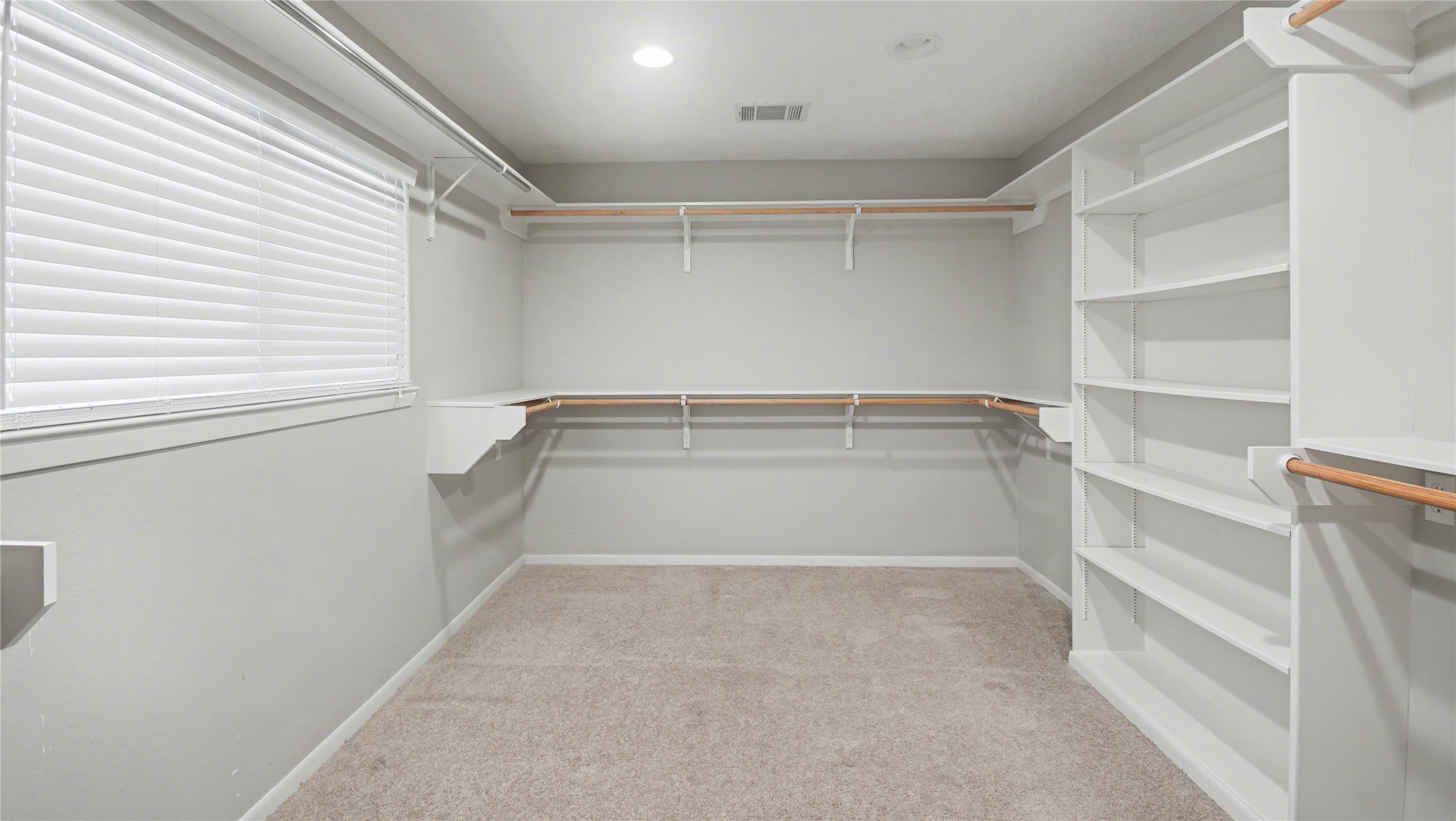 1431 Walnut Lane Houston, TX 77339 - Photo 18 of 44 Experience ultimate organization in this spacious walk-in closet, complete with ample shelving and hanging space for your entire wardrobe.