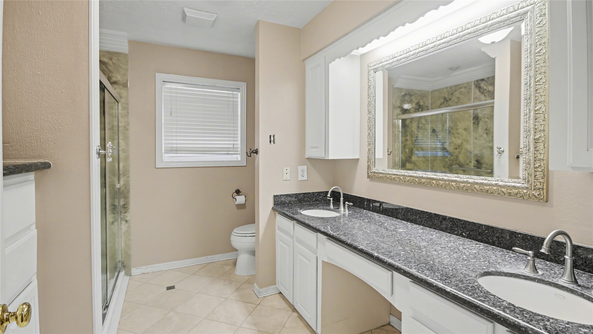 1431 Walnut Lane Houston, TX 77339 - Photo 20 of 47 a bathroom with a granite countertop sink toilet and shower