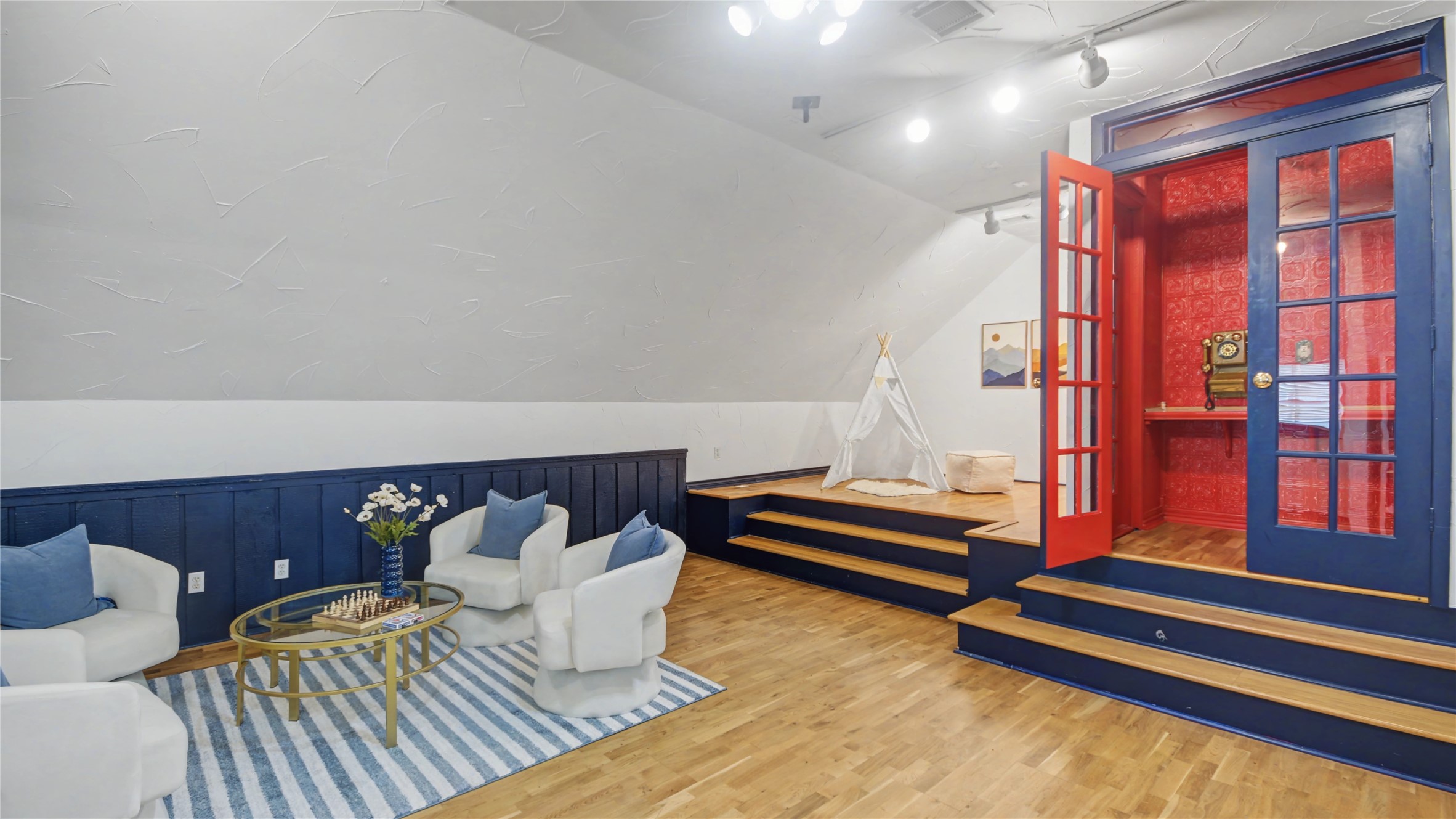 1431 Walnut Lane Houston, TX 77339 - Photo 24 of 44 Creative studio with a custom stage and a truly unique phone booth — a feature that makes the space both memorable and functional.