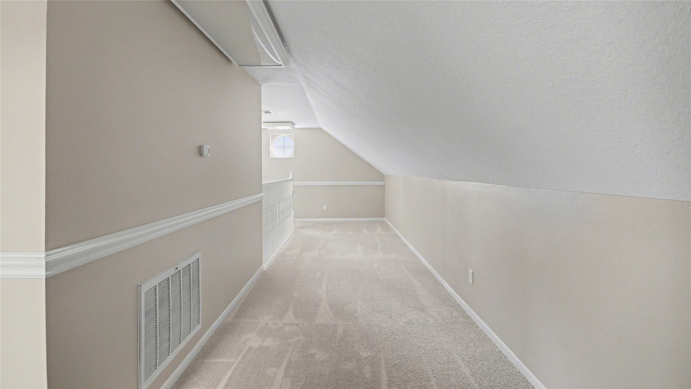 1431 Walnut Lane Houston, TX 77339 - Photo 29 of 46 A cozy, inviting 2nd floor hallway in the guest quarters, promising comfort and charm for your visitors.