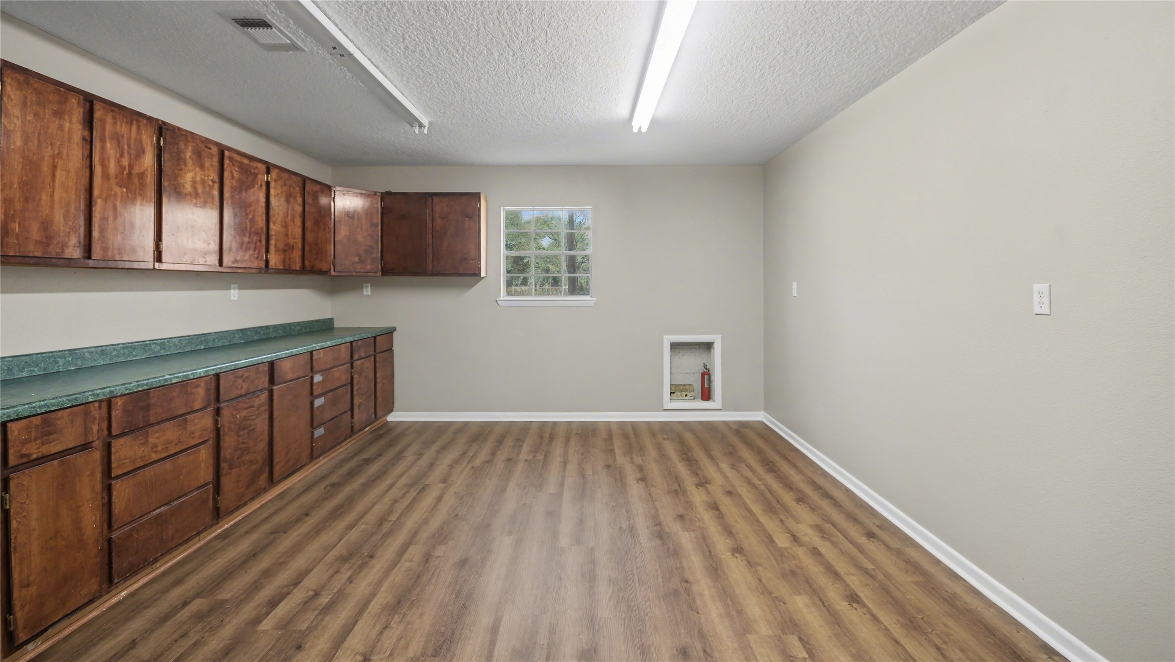 1431 Walnut Lane Houston, TX 77339 - Photo 36 of 47 a view of a kitchen with wooden floor and a sink