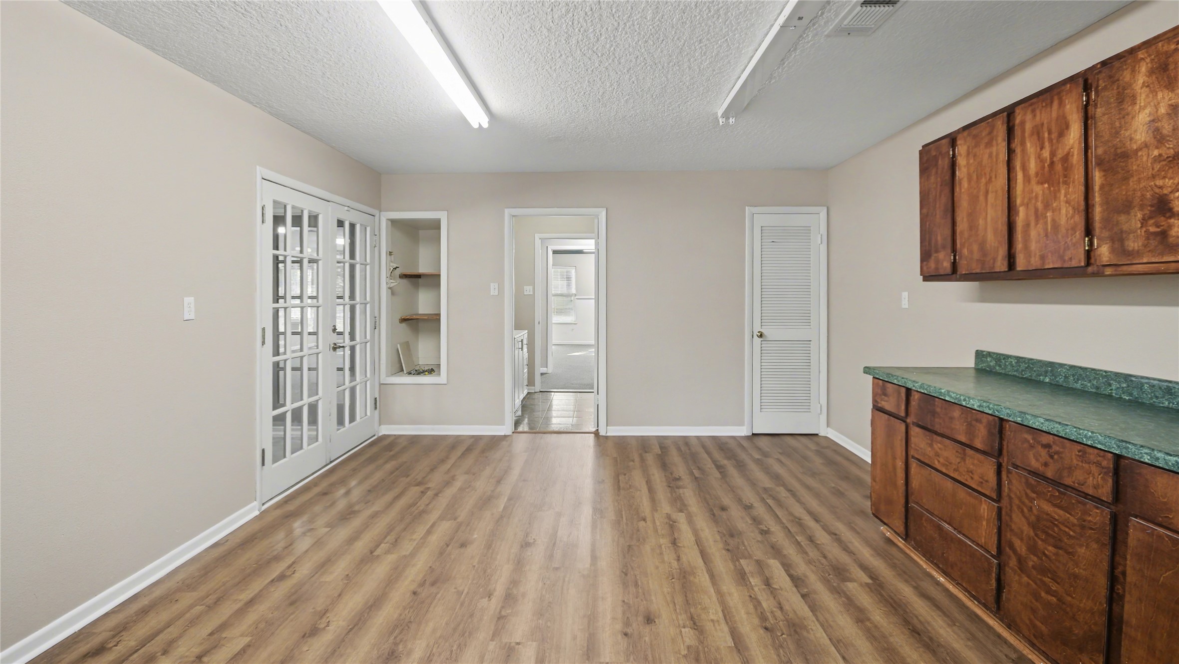 1431 Walnut Lane Houston, TX 77339 - Photo 37 of 47 a view of an empty room with window and wooden floor
