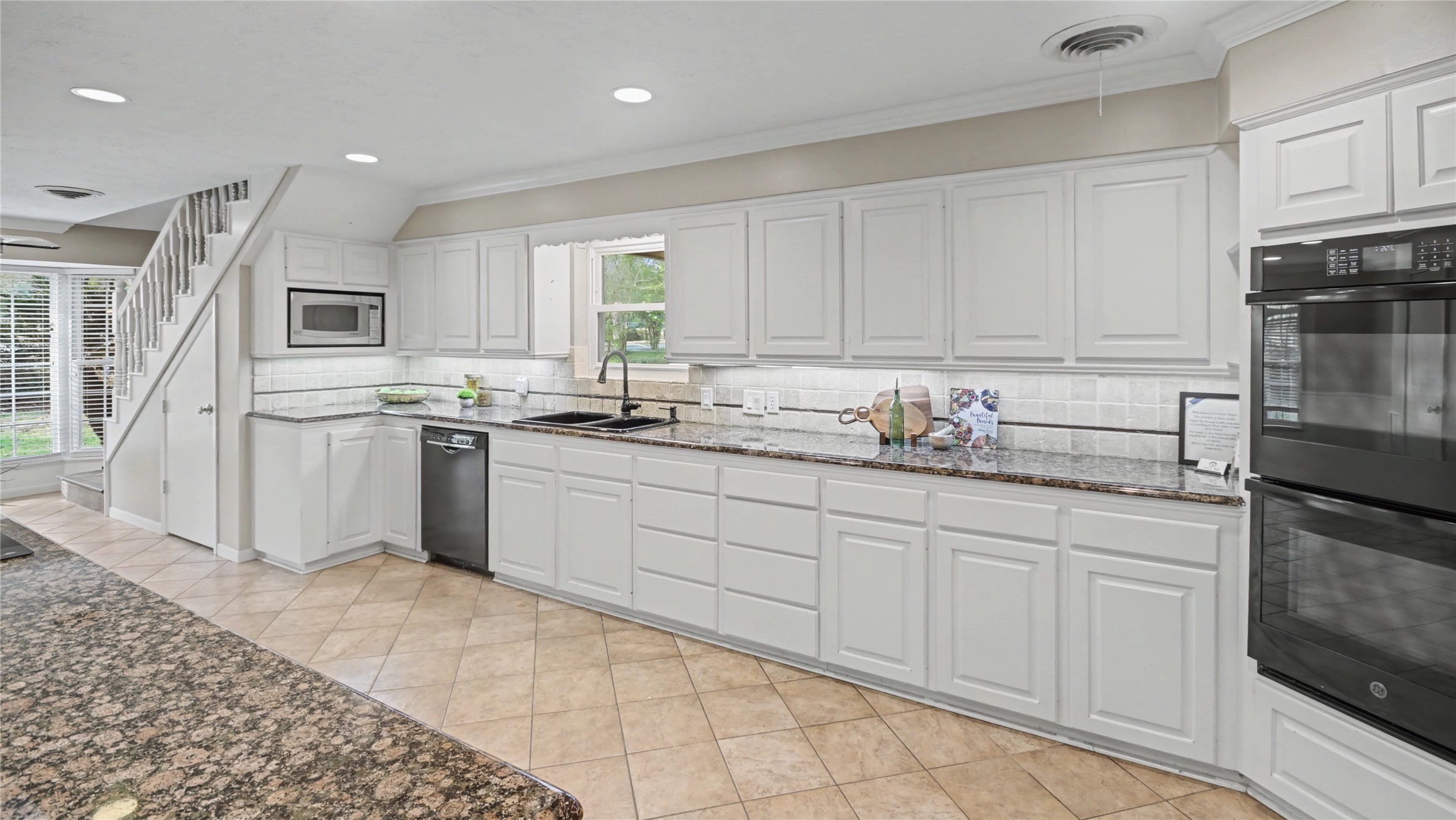 1431 Walnut Lane Houston, TX 77339 - Photo 5 of 44 Cabinetry throughout provides ample storage, paired with a double oven that supports both everyday cooking and entertaining.