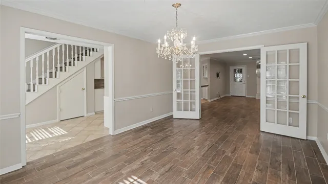 a view of a dining room with furniture and book shelf